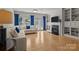 Bright living room with hardwood floors, a fireplace, and custom built-in shelving at 112 E Neel Ranch Rd, Mooresville, NC 28115