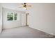 Bare bedroom featuring a large window with lots of natural light at 11234 Villa Trace Pl, Charlotte, NC 28277