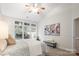 Cozy bedroom featuring a large window and a comfortable cushioned bench at 11234 Villa Trace Pl, Charlotte, NC 28277