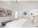 Bedroom with neutral decor, with access to the bathroom through the door on the right at 11234 Villa Trace Pl, Charlotte, NC 28277