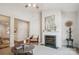 Bright living room featuring a fireplace, neutral colors, and an open floorplan at 11234 Villa Trace Pl, Charlotte, NC 28277