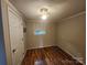 Bright bedroom with hardwood floors, a ceiling fan, and natural light from a window at 11550 Us Hwy 52 N Hwy, Ansonville, NC 28170