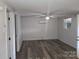 Open-concept living room featuring a modern ceiling fan, light grey walls and a window to let in natural light at 11550 Us Hwy 52 N Hwy, Ansonville, NC 28170