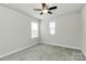 Bedroom featuring two windows, neutral colors, and carpeted floors at 11733 Mesquite Rd, Huntersville, NC 28078