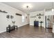 Spacious living room with modern wood floors, neutral walls, and decorative shelving at 11733 Mesquite Rd, Huntersville, NC 28078