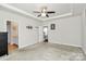 Spacious main bedroom features a trey ceiling with fan, neutral colors, and ensuite bathroom at 11733 Mesquite Rd, Huntersville, NC 28078
