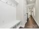 Mudroom with built-in bench, storage cubbies, and hooks for organization at 11733 Mesquite Rd, Huntersville, NC 28078
