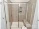 Beautiful tiled shower with glass doors and built-in bench at 11733 Mesquite Rd, Huntersville, NC 28078
