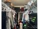 A spacious walk-in closet that is fully stocked with an abundance of clothing and multiple shelves at 1177 Triece Ln, Charlotte, NC 28215