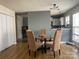 Dining room with hardwood floors and a glass table at 1177 Triece Ln, Charlotte, NC 28215