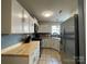 Well-lit kitchen with stainless steel appliances, and a tile floor at 1177 Triece Ln, Charlotte, NC 28215