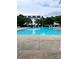 Community swimming pool offers a refreshing oasis with ample seating and a view of the neighborhood at 1177 Triece Ln, Charlotte, NC 28215