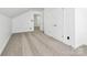 Bedroom with neutral carpet, double closet, and connecting doors, offering a versatile and functional space at 12300 Caldwell Rd, Charlotte, NC 28213