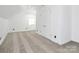 Bedroom with neutral carpet, double closet, and a bright window, providing a cozy space with ample natural light at 12300 Caldwell Rd, Charlotte, NC 28213