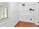 Walk-in closet featuring shelving and window providing natural light at 12300 Caldwell Rd, Charlotte, NC 28213