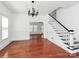Elegant dining room with hardwood floors and stylish staircase at 12300 Caldwell Rd, Charlotte, NC 28213