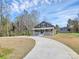 Charming home features a welcoming front porch and a long driveway at 12300 Caldwell Rd, Charlotte, NC 28213