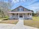 Lovely home featuring a cozy front porch, perfect for relaxing outdoors at 12300 Caldwell Rd, Charlotte, NC 28213