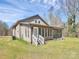 Charming single-story home featuring a welcoming screened porch perfect for enjoying the outdoors at 12300 Caldwell Rd, Charlotte, NC 28213