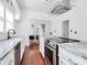 Modern kitchen with stainless appliances, stone countertops, and bright natural light at 12300 Caldwell Rd, Charlotte, NC 28213