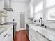 Bright, modern kitchen features stone countertops, stainless appliances and under cabinet lighting at 12300 Caldwell Rd, Charlotte, NC 28213