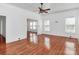Open living room showcasing gleaming hardwood floors and bright windows at 12300 Caldwell Rd, Charlotte, NC 28213