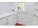Bright pantry features white shelves and cabinets for optimized storage at 12300 Caldwell Rd, Charlotte, NC 28213