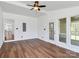 Sunroom with ceiling fan, great light, and wood-look floors at 12300 Caldwell Rd, Charlotte, NC 28213