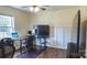 Bedroom featuring sleek, modern decor with neutral wall color and hardwood floors at 1327 Mount Ulla Hwy, Mooresville, NC 28115