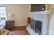 Bedroom featuring hardwood floors, neutral walls, and a charming brick fireplace at 1327 Mount Ulla Hwy, Mooresville, NC 28115