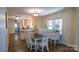 Inviting dining area with classic furnishings, blending seamlessly with an open-concept kitchen at 1327 Mount Ulla Hwy, Mooresville, NC 28115