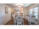 Bright dining area featuring hardwood floors, natural light, and access to a modern kitchen at 1327 Mount Ulla Hwy, Mooresville, NC 28115