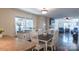 Open dining area with hardwood floors that flows into a comfortable living space at 1327 Mount Ulla Hwy, Mooresville, NC 28115