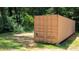 Exterior view of a tan container in a wooded lot at 1327 Mount Ulla Hwy, Mooresville, NC 28115