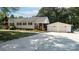 Charming white house with a two-car garage and well-maintained front yard at 1327 Mount Ulla Hwy, Mooresville, NC 28115