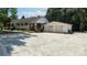 Wide angle of a white home and detached two-car garage from the front at 1327 Mount Ulla Hwy, Mooresville, NC 28115