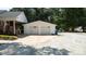 Two-car garage with matching doors and long driveway at 1327 Mount Ulla Hwy, Mooresville, NC 28115