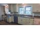 Well-lit kitchen with custom cabinetry, providing ample storage and counter space for meal preparation at 1327 Mount Ulla Hwy, Mooresville, NC 28115