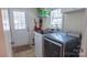 Functional laundry room with modern washer and dryer at 1327 Mount Ulla Hwy, Mooresville, NC 28115