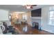 Open living space connects the kitchen, dining area, and living room with hardwood floors at 1327 Mount Ulla Hwy, Mooresville, NC 28115