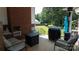 Relaxing covered patio with a fireplace, a grill and comfortable seating at 1327 Mount Ulla Hwy, Mooresville, NC 28115