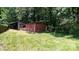 Backyard storage shed on a lush green lawn at 1327 Mount Ulla Hwy, Mooresville, NC 28115