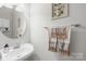 Bathroom with a decorative mirror and cute towels that accent the space at 136 Pink Orchard Dr, Mooresville, NC 28115