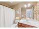 Bathroom with a white shower curtain, neutral paint and tile, and plenty of storage at 136 Pink Orchard Dr, Mooresville, NC 28115
