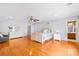 Large bedroom with hardwood floors, modern decor and a connected bathroom at 136 Pink Orchard Dr, Mooresville, NC 28115