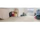 Versatile bonus room with carpeting, ample space, and natural light from the window at 136 Pink Orchard Dr, Mooresville, NC 28115