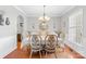 Formal dining room featuring hardwood floors and an ornate chandelier at 136 Pink Orchard Dr, Mooresville, NC 28115