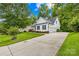 Lovely two-story home featuring a large driveway and well-maintained yard at 136 Pink Orchard Dr, Mooresville, NC 28115