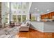 Bright living room boasts natural light, a fireplace, and seamless access to the kitchen at 136 Pink Orchard Dr, Mooresville, NC 28115