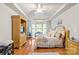 Comfortable main bedroom with a sitting area, tray ceiling, and ample natural light at 136 Pink Orchard Dr, Mooresville, NC 28115